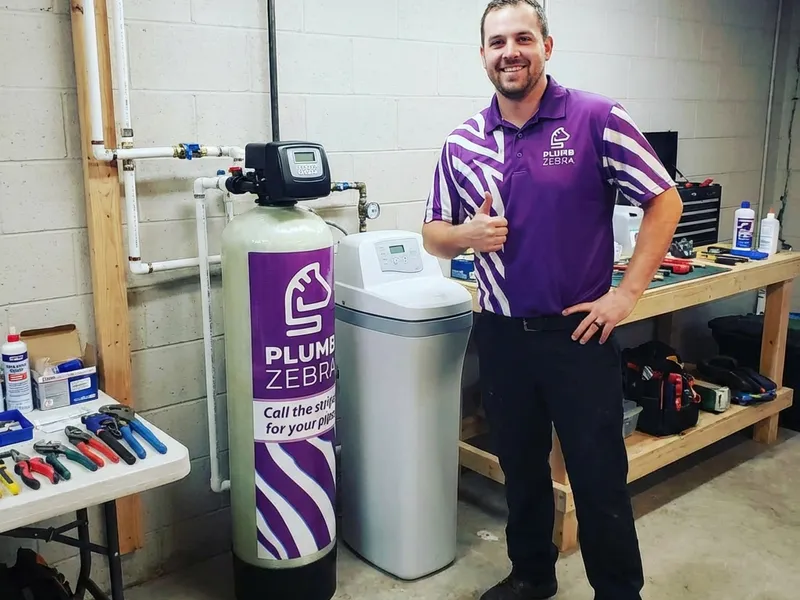 Professional plumber performing water softener installation spokane wa service